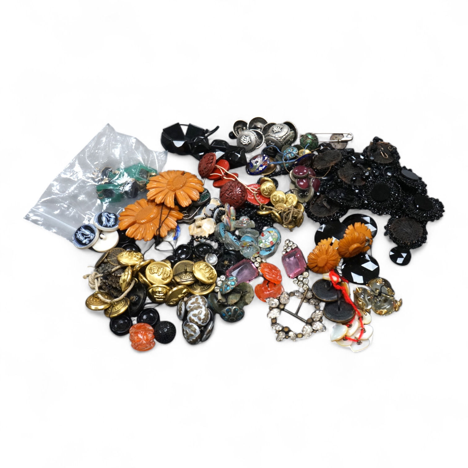 A collection of late 19th and 20th century buttons, some novelty, made from varying materials, metal, bakelite and glass.